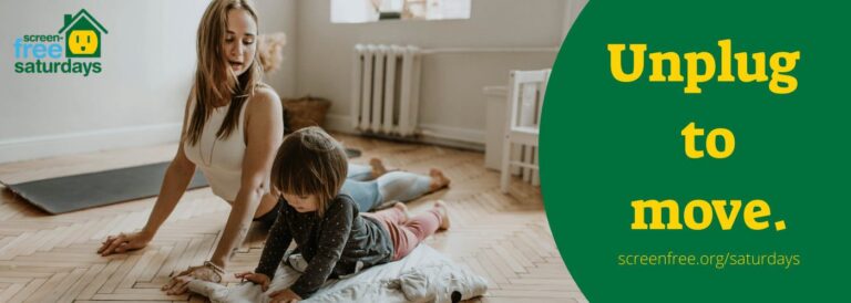 Mother and child doing yoga together indoors.