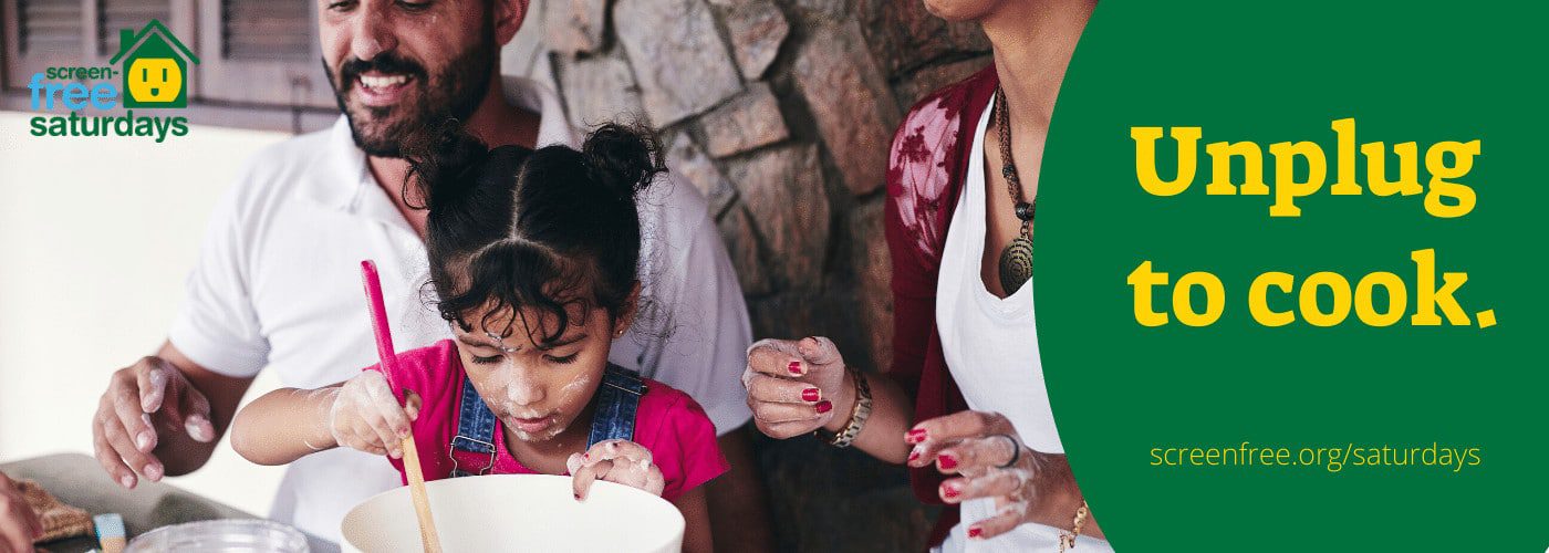 Family cooking together, promoting unplugged Saturdays.