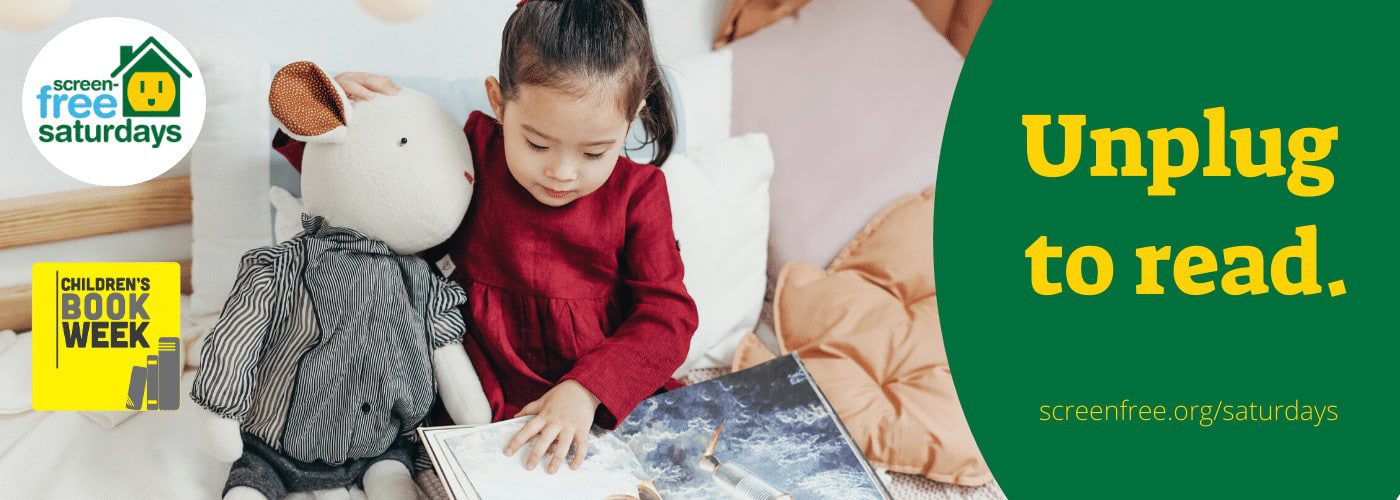 Child reading with stuffed toy, promoting unplugging.