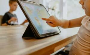 person using white tablet computer